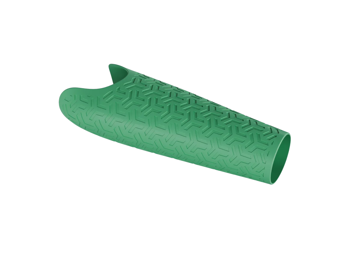 Prime prosthetic arm cover in grass green, featuring an engraved abstract arrow pattern for a dynamic, sporty look.